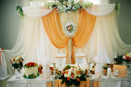 beautiful wedding  table decoration decor of the newlyweds in peach tonesの写真素材