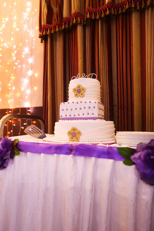 Beautiful multi-tiered wedding cake with  purple tonesの写真素材