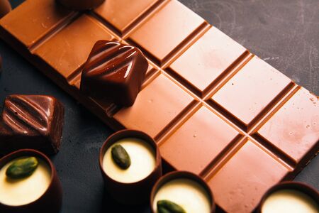 Many chocolate sweets with Pistachio on black backgroundの写真素材