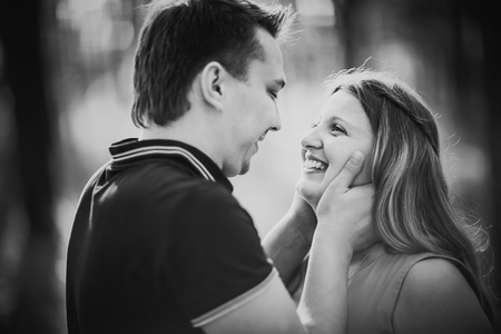 Black white photography romantic young couple  laugh on background summer forestの写真素材