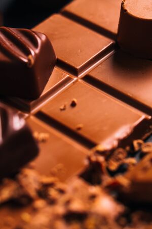 Many candy and chocolate  chips on a black backgroundの写真素材
