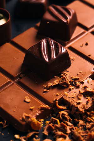 Many candy and chocolate  chips on a black backgroundの写真素材
