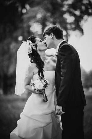 Black white photography  wedding beautiful young couple stand on background forestの写真素材