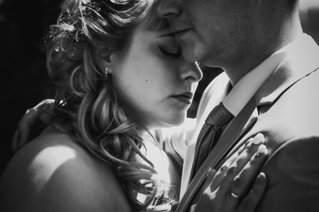 Black white  photography  beautiful wedding young couple stand on  background forestの写真素材