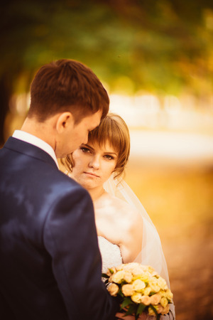 young bride and groom on  the bluer backgroundの写真素材