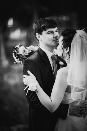 Black white photography  wedding beautiful young couple stand on background forestの写真素材