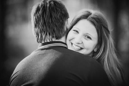 Black white photography romantic young couple kissing  on background summer forestの写真素材