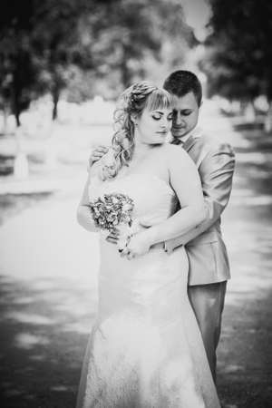 Black white  photography  beautiful wedding young couple stand on  background forestの写真素材