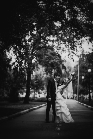 Black white photography beautiful young couple stand on  background forestの写真素材