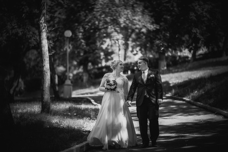Black white  photography beautiful young couple stand on  background forestの写真素材