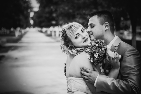 Black white  photography  beautiful wedding young couple stand on  background forestの写真素材