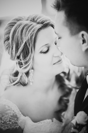 Black white photography bride and groom posing  in a hotel roomの写真素材