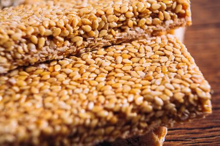 Kozinaki of sesame and peanut  on a wooden backgroundの写真素材