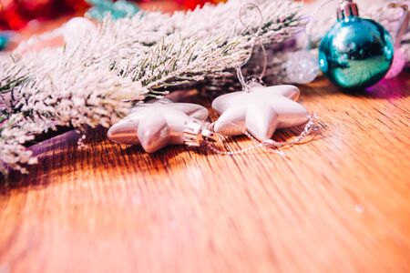 Spruce branches in the snow,  and blue balls wooden backgroundの写真素材