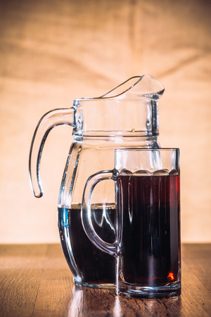 Russian brew in mug and jug of rye  flour on wooden backgroundの写真素材