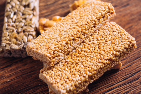 Kozinaki of sesame and peanut  on a wooden backgroundの写真素材