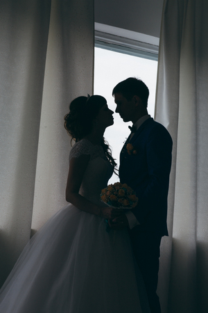 bride and groom silhouettes in the studio.の写真素材