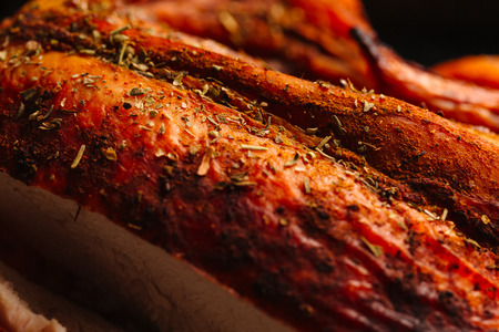 Fresh baked chicken with golden brown chopped closeup.の写真素材