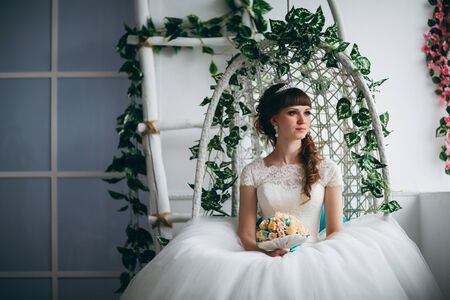 Portrait of a young happy bride in studio.の写真素材