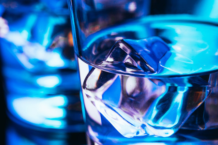 Two glasses of vodka with ice closeup.の写真素材