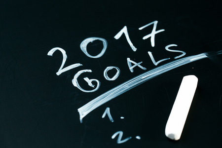 inscription 2017 goals it list drawn with chalk on a school blackboard dark.