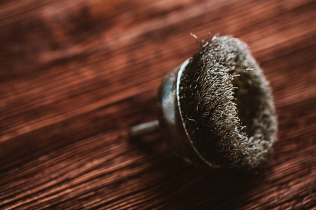 Brush drill on a dark wooden background.