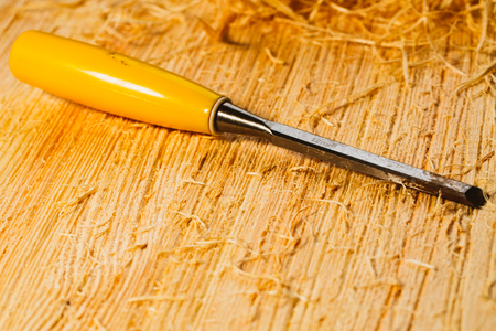 wood chips and cutters lie on a wooden board close-up.の写真素材