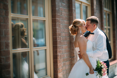 bride and groom on the background of the city.の写真素材