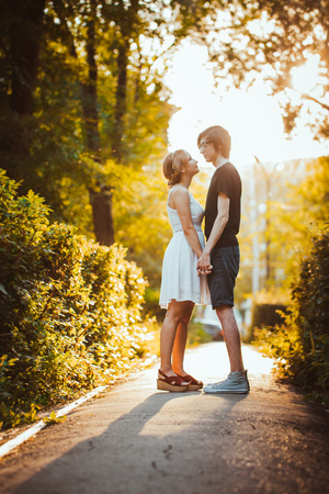 guy and the girl embracing on a background of parkの写真素材