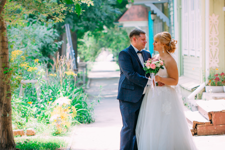 bride and groom on the background of the cityの写真素材