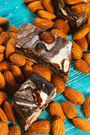 candy paste and almonds on blue wooden backgroundの写真素材