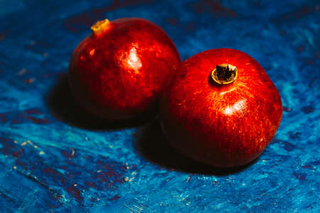 Whole red garnet on blue abstract backroundの写真素材