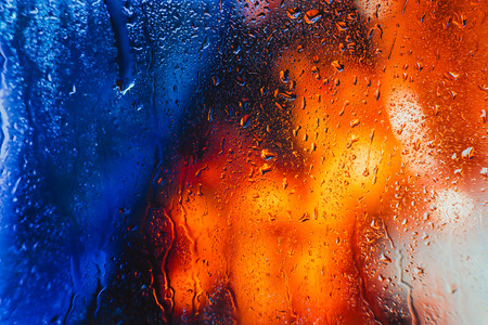 Drops of rain on the window of the car in the eveningの写真素材