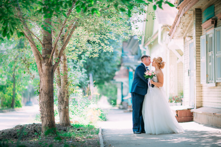 bride and groom on the background of the cityの写真素材