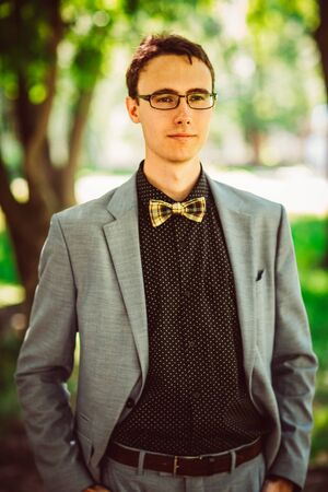 Handsome young guy with a bow tieの写真素材