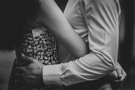 Black and white photo beautiful young couple in the parkの写真素材