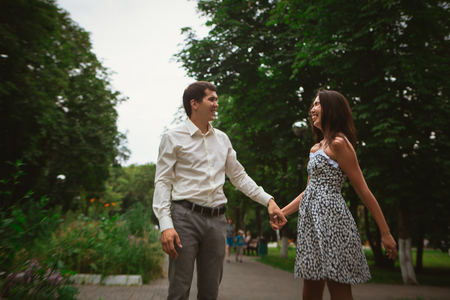 Beautiful young couple on a nature backgroundの写真素材