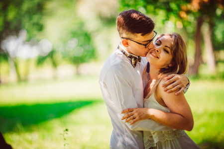 Young beautiful couple on a blurred natural backgroundの写真素材
