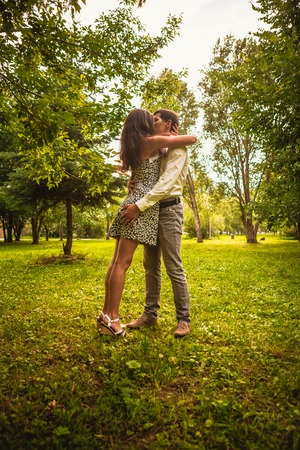 Beautiful young couple in the parkの写真素材