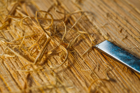 wood chips and cutters lie on a wooden boardの写真素材