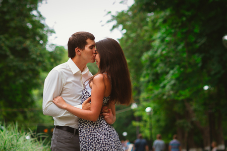 Beautiful young couple on a nature backgroundの写真素材