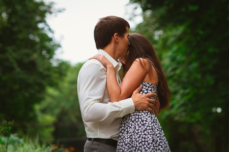 Beautiful young couple on a nature backgroundの写真素材