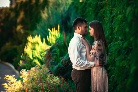Beautiful young couple on a nature backgroundの写真素材