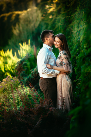 Beautiful young couple on a nature backgroundの写真素材