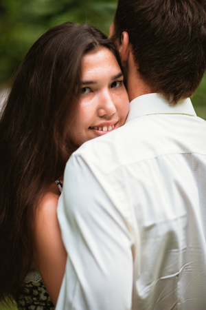 Beautiful young couple in the parkの写真素材