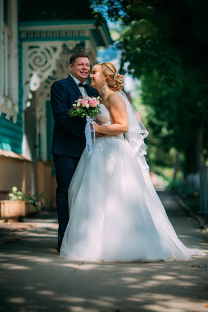 bride and groom on the background of the cityの写真素材