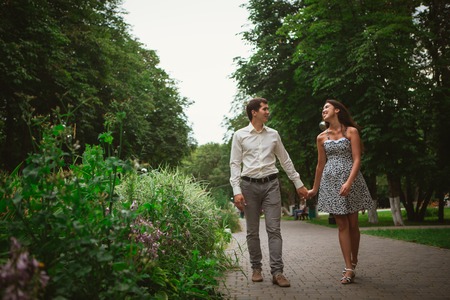 Beautiful young couple on a nature backgroundの写真素材