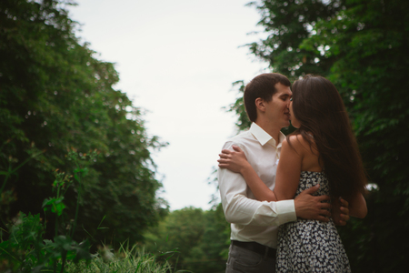 Beautiful young couple on a nature backgroundの写真素材