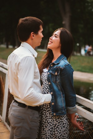 Beautiful young couple on the waterfrontの写真素材