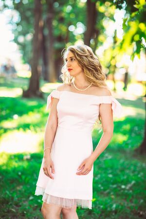 beautiful girl blonde on nature backgroundの写真素材